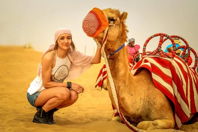 desert safari camel picture with a female tourist