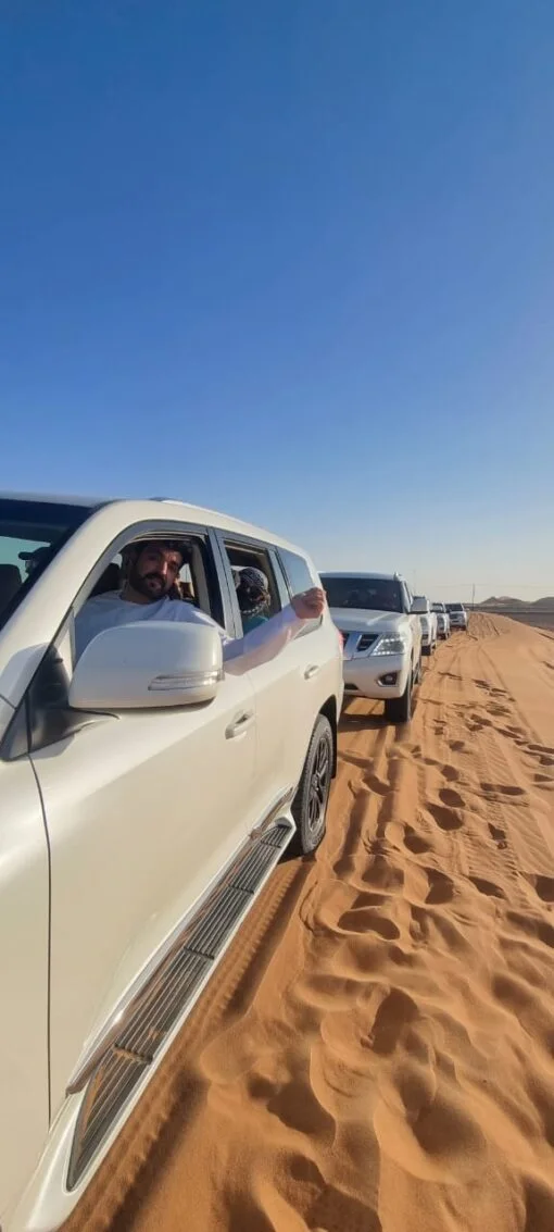The convoy of SUV and the desert safari guides in the dubai desert